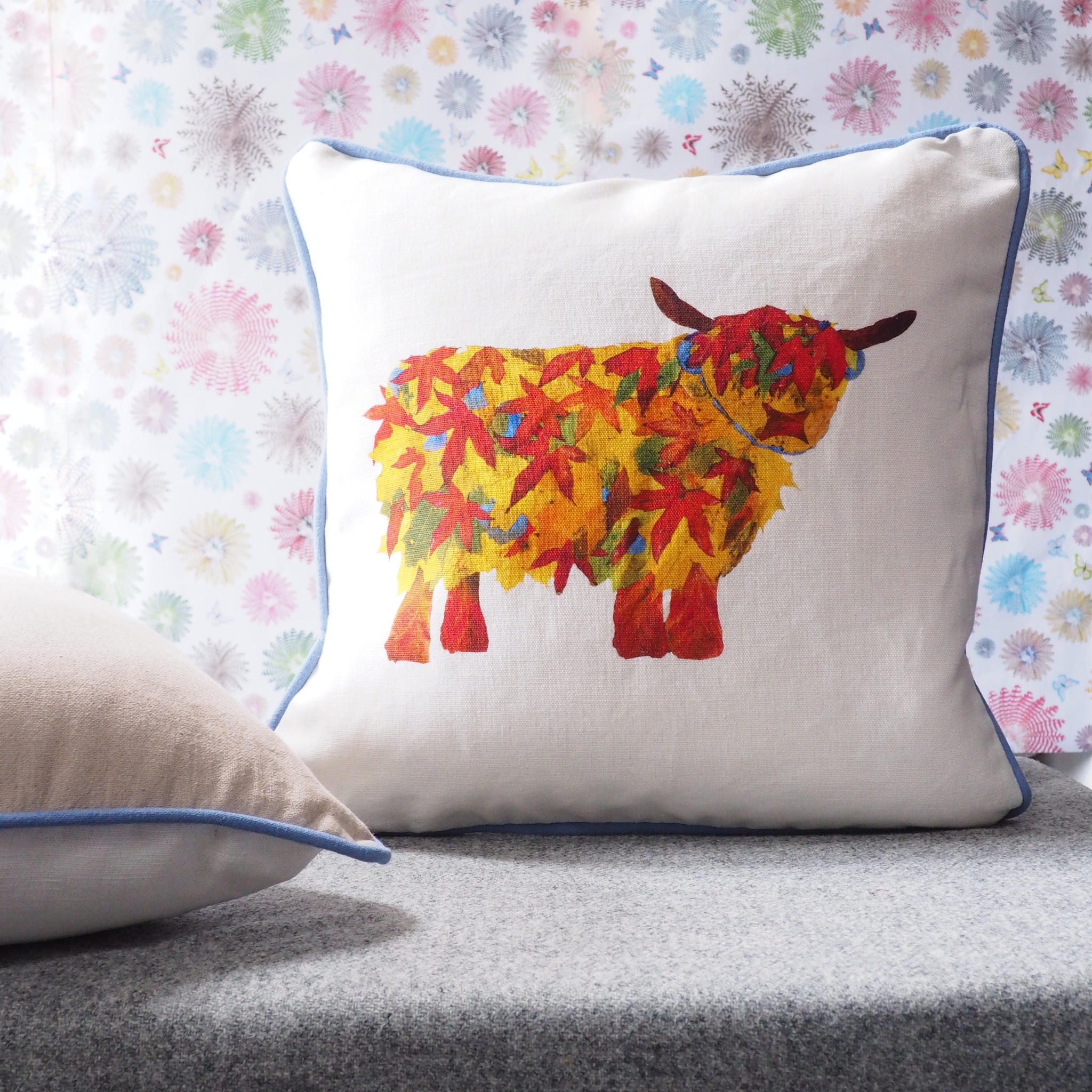 Leaf Highland Cow cushion by Chloe Gardner.