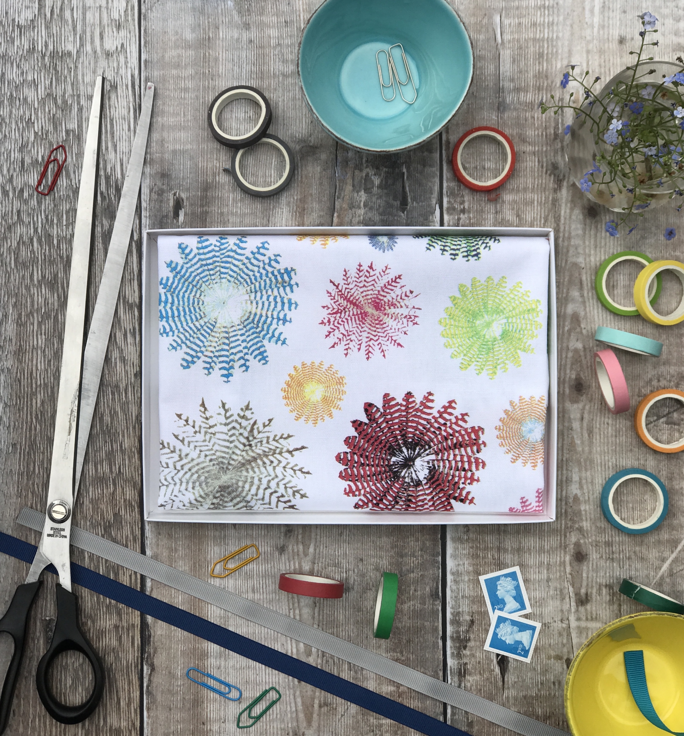 tea towel folded in an open box rounds