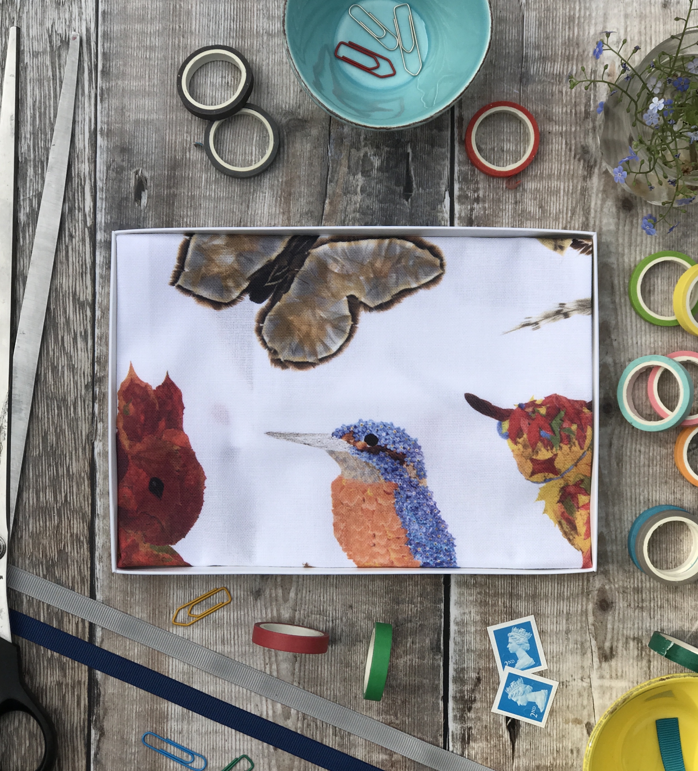 tea towel folded in an open box medley