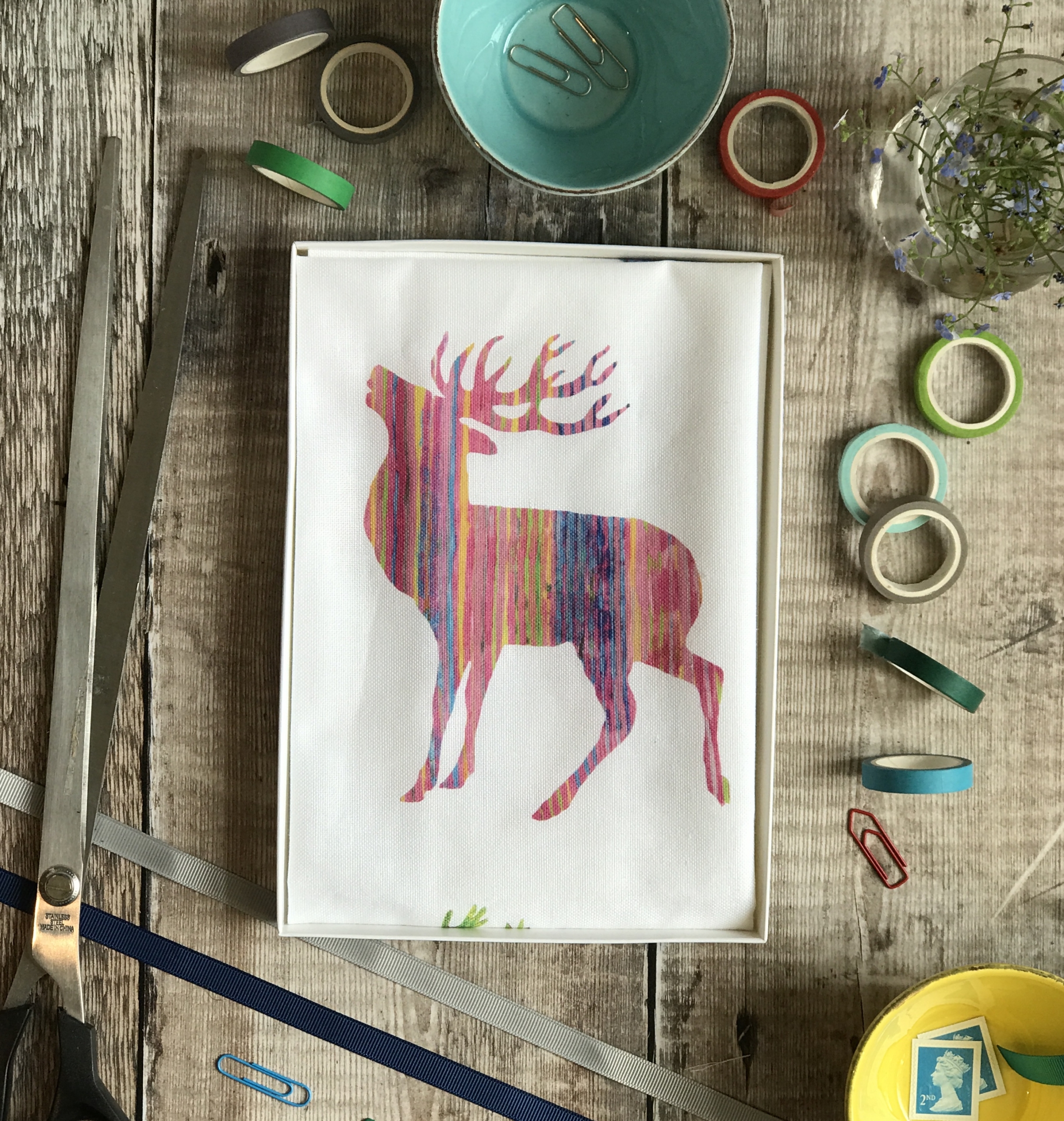 tea towel folded in an open box multi stag