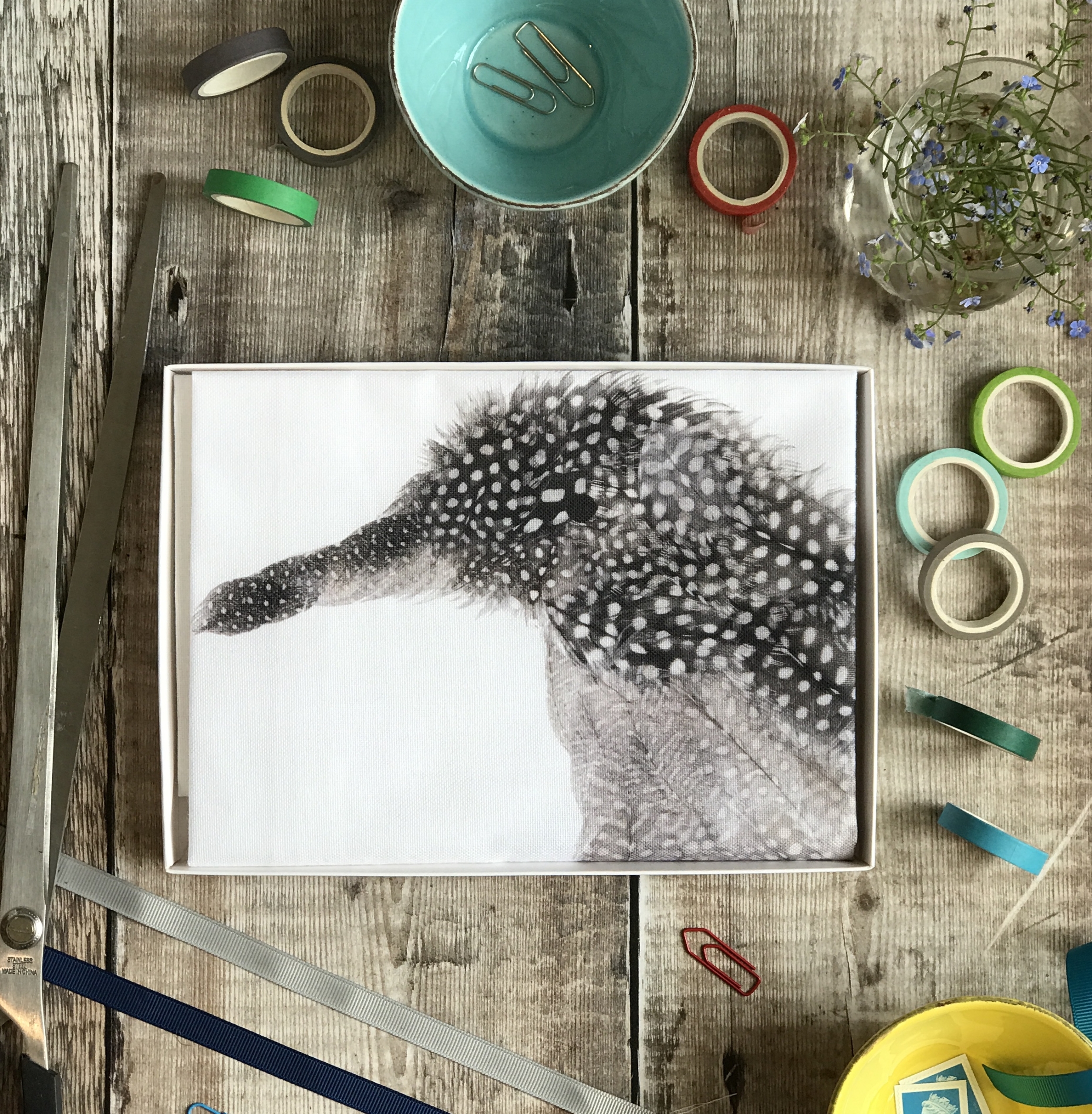 tea towel folded in an open box penguin