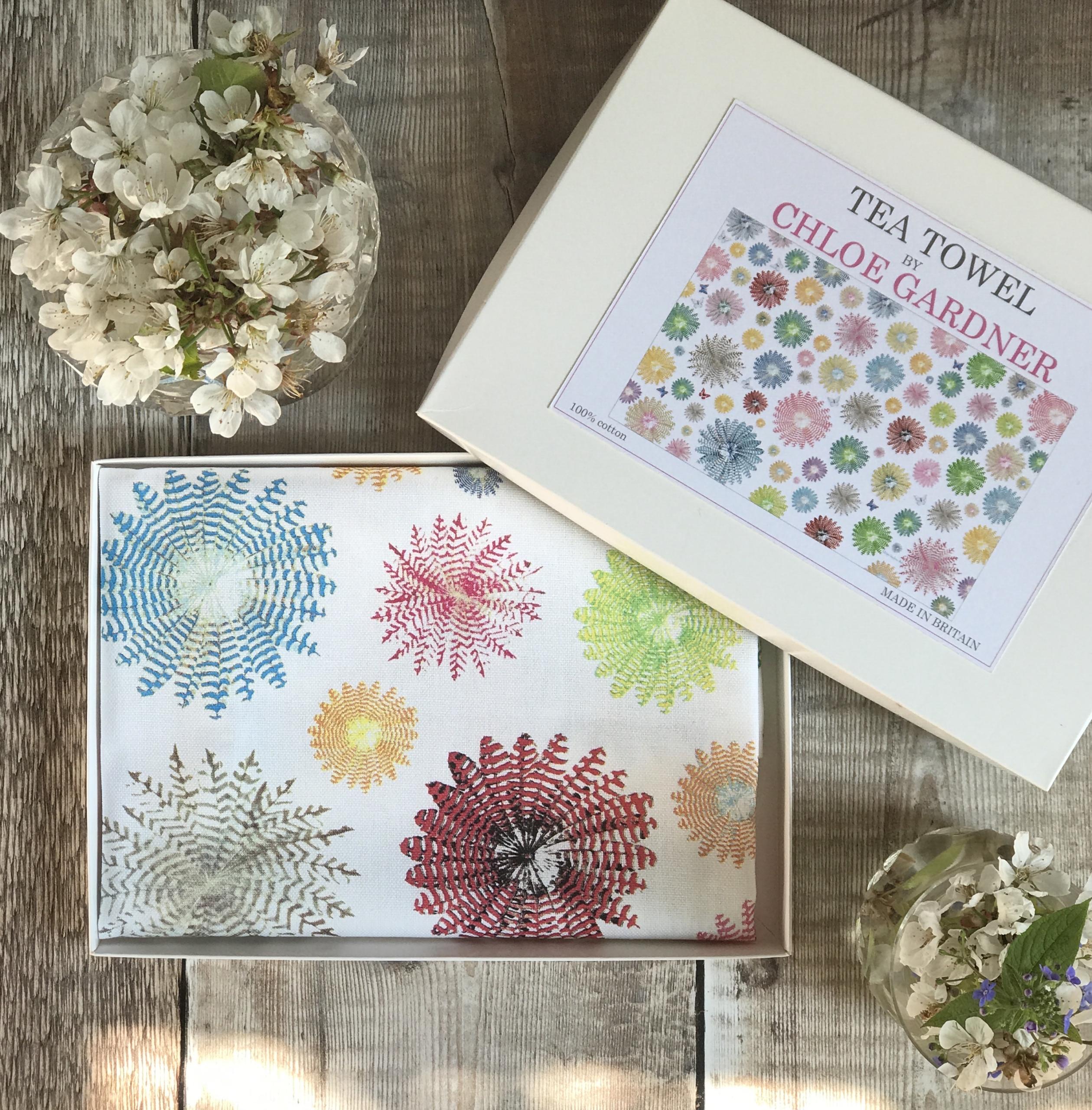 A GIFT BOXED TEA TOWEL - Colourful Feather Rounds