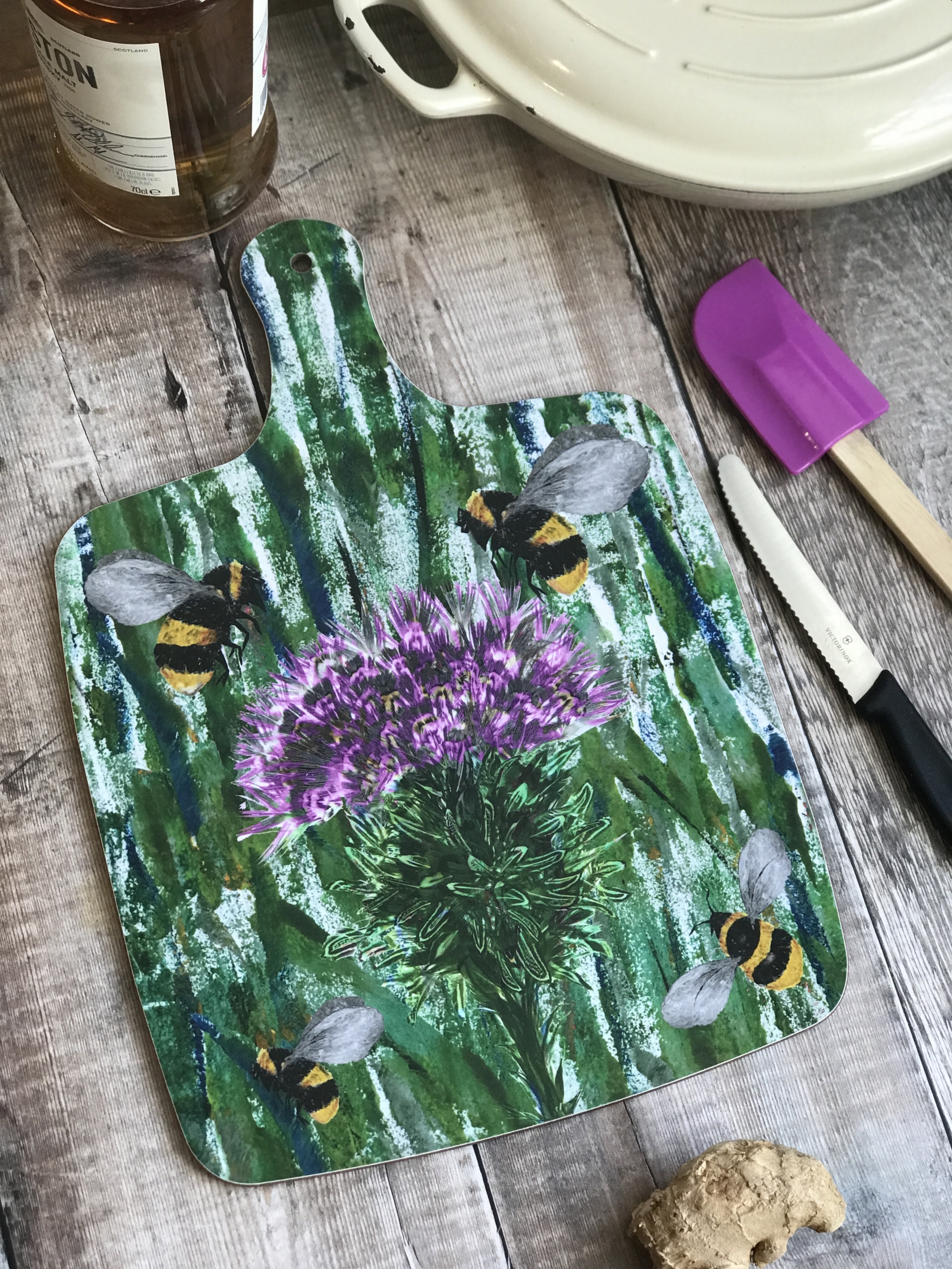 chopping board large bees and thistle close up