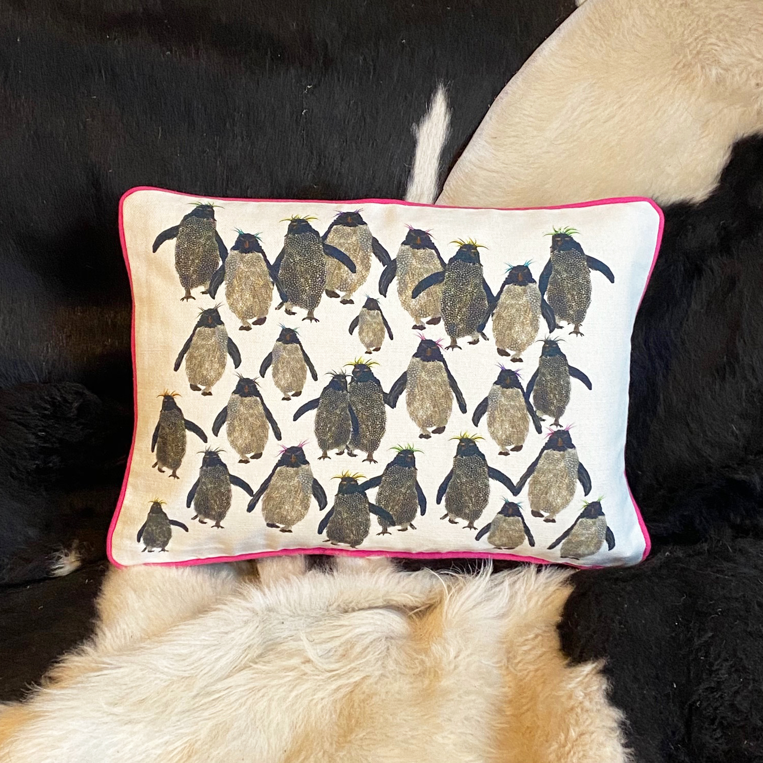 Rockhopper repeat cushion small pink piping on sofa square image