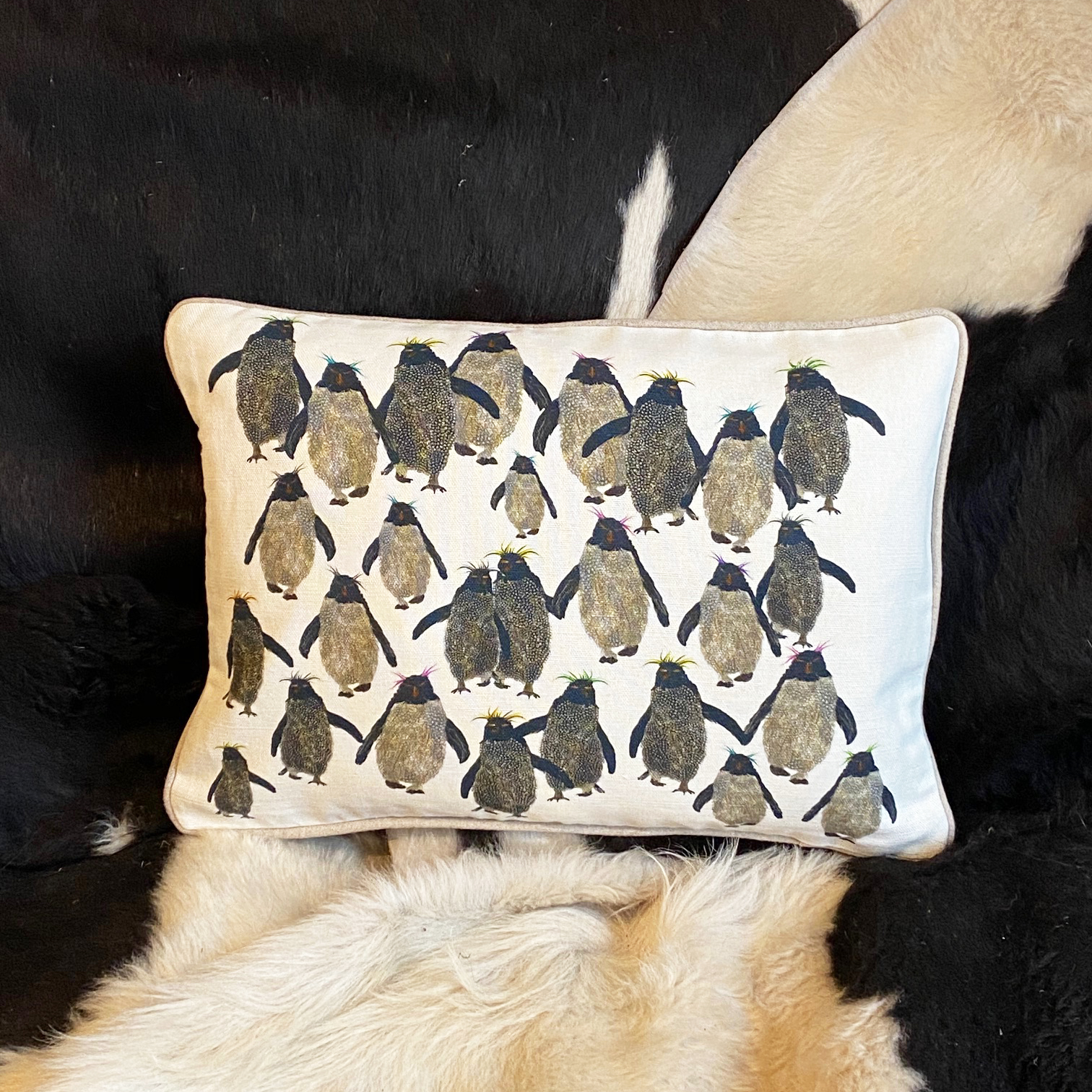 Rockhopper repeat cushion small with natural piping on sofa A