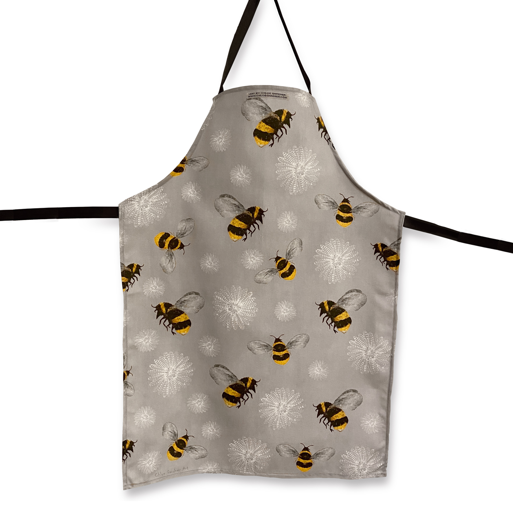 Bees with Flowers Apron, a cooton apron with illustrated bees on a light grey background with flowers formed from white feathers