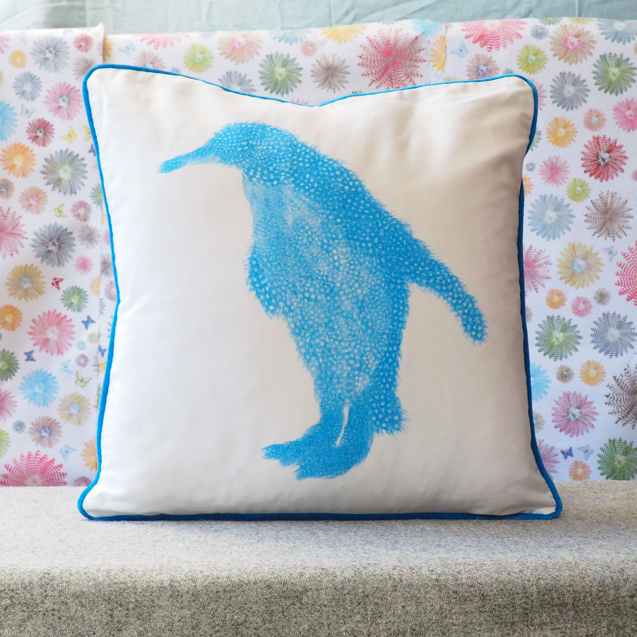 SQUARE CUSHION - Fluoro Blue Penguin Facing Left with blue trim (Blue Piping)(Avail R3F14 04/25)