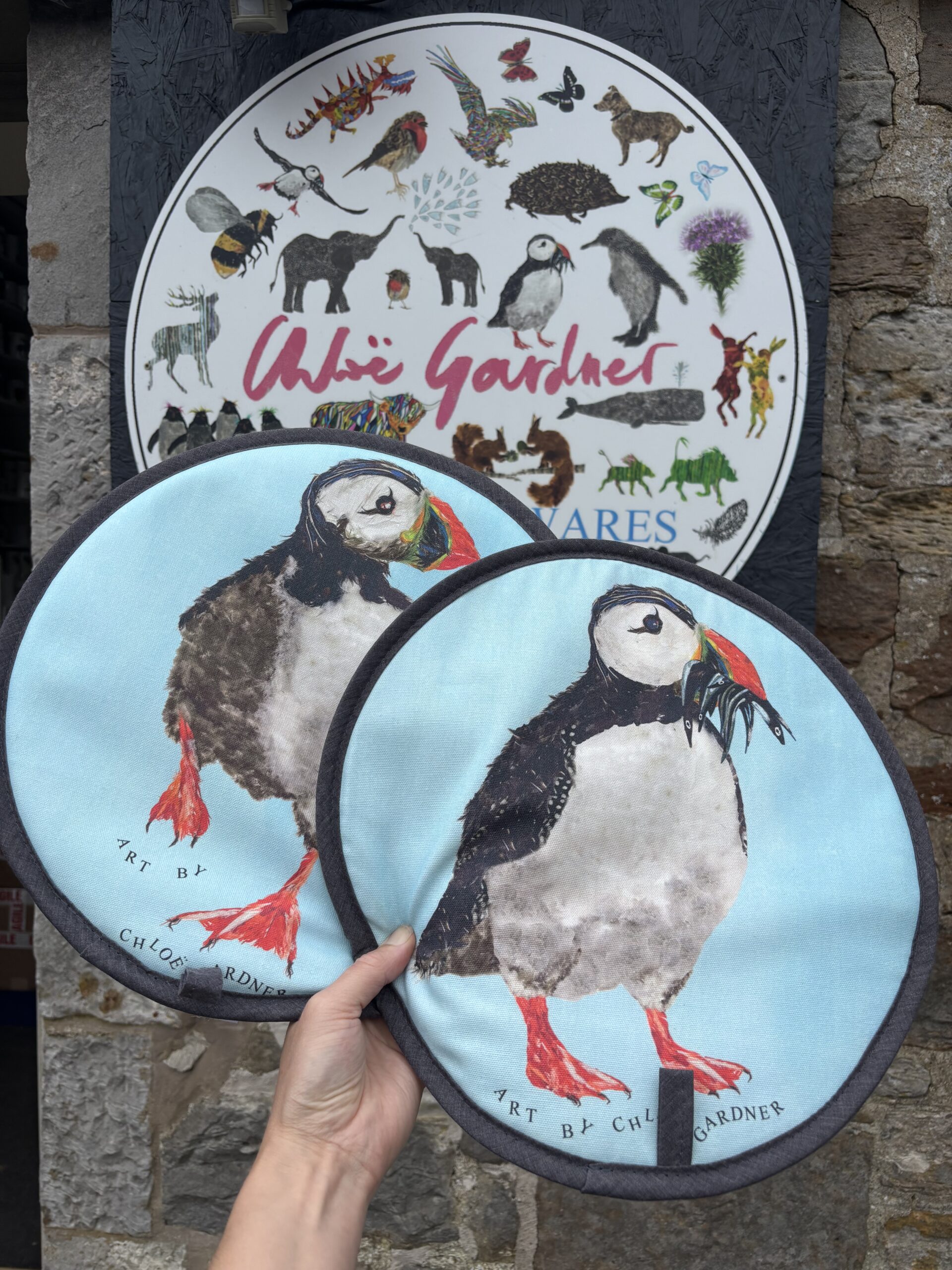 Aga pads covers pair in two puffin designs Puffin with fish and puffin running aga pad pair or aga covers or table bases